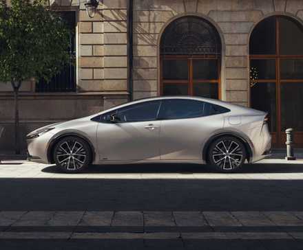 Side profile shot of a silver 2023 Toyota Prius parked 