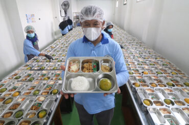Safe plates: A staff member displays a free nutritious meal program platter on Monday during the launch of the nutritional fulfill- ment service unit (SPPG), at Al Amien Islamic Boarding School in Kediri, East Java. Equipped with proper sanitation and health standards, the unit has a cooking capacity of up to 3,400 portions per day. It was launched to provide free meals to boarding school students and pupils from several schools.