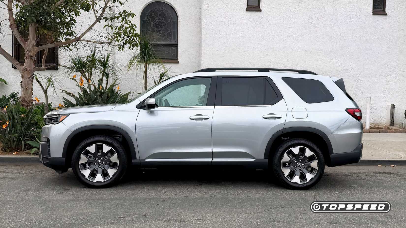 2026 Honda Pilot profile parked in front of house