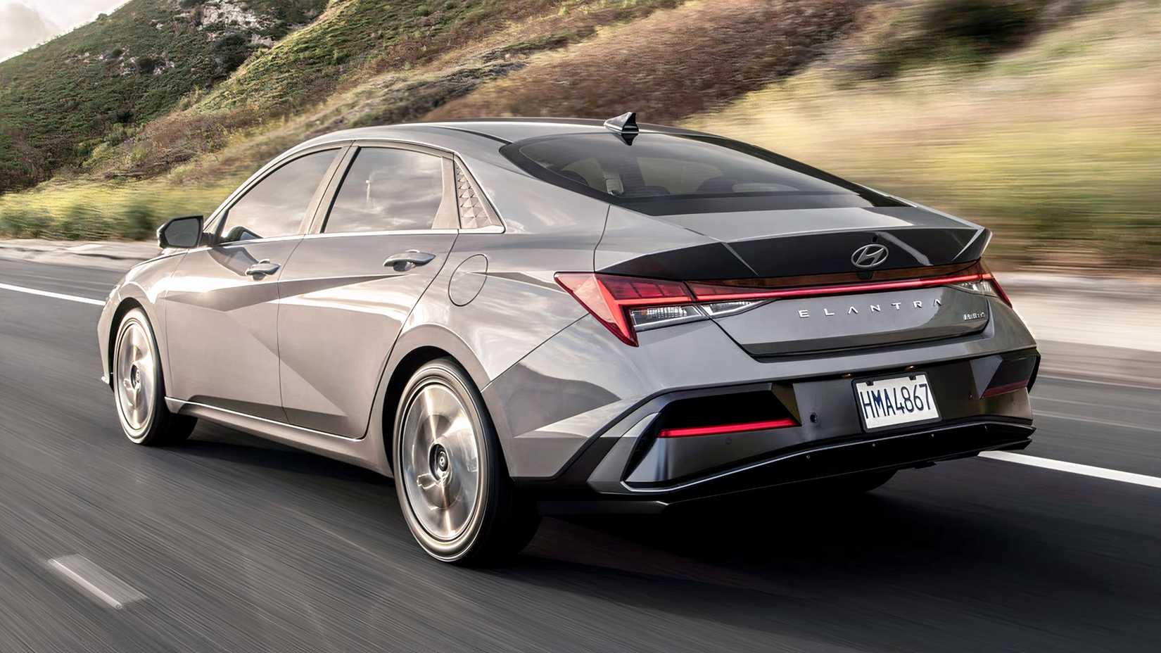 Gray 2026 Hyundai Elantra Hybrid Rear 3/4 View While Driving