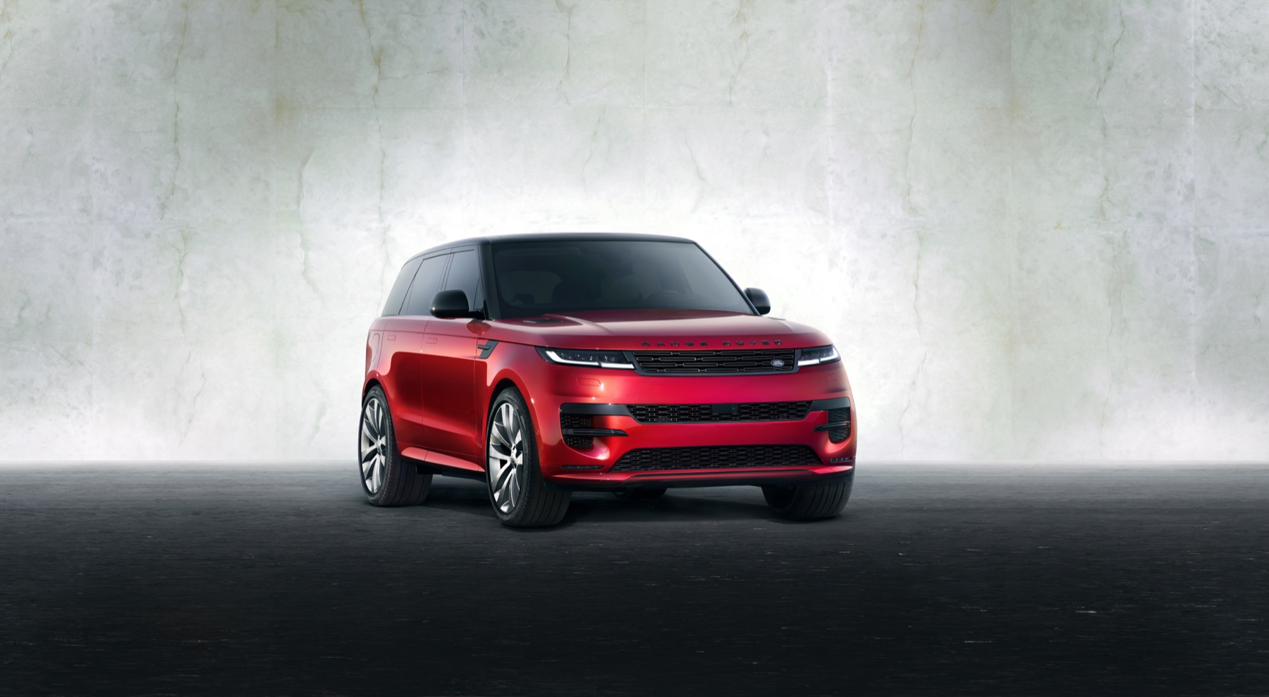 2026 Range Rover Sport P550e plug-in hybrid SUV in studio front three-quarter view