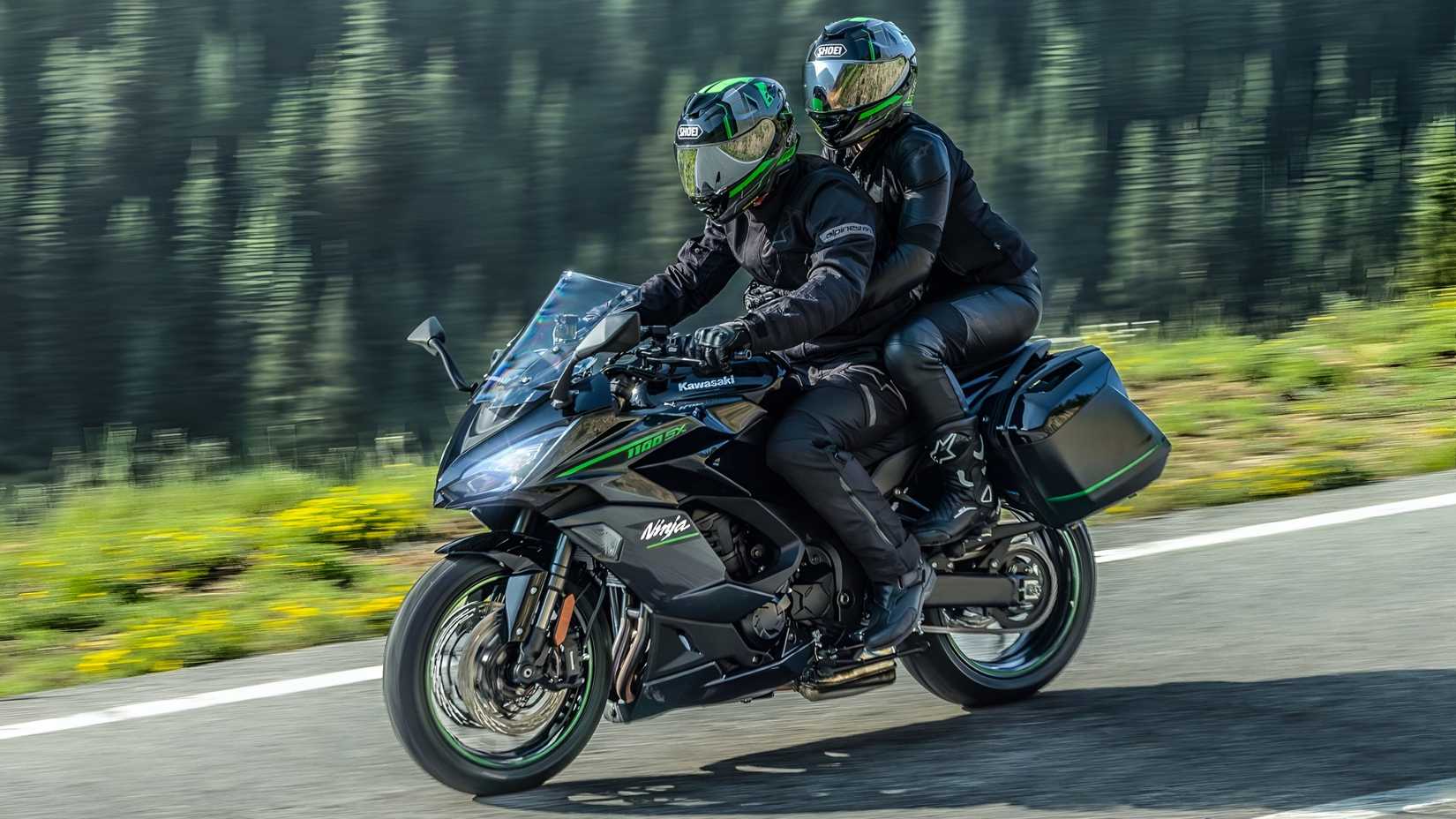 Kawasaki Ninja 1100SX rolling with pillion and luggage front third quarter view