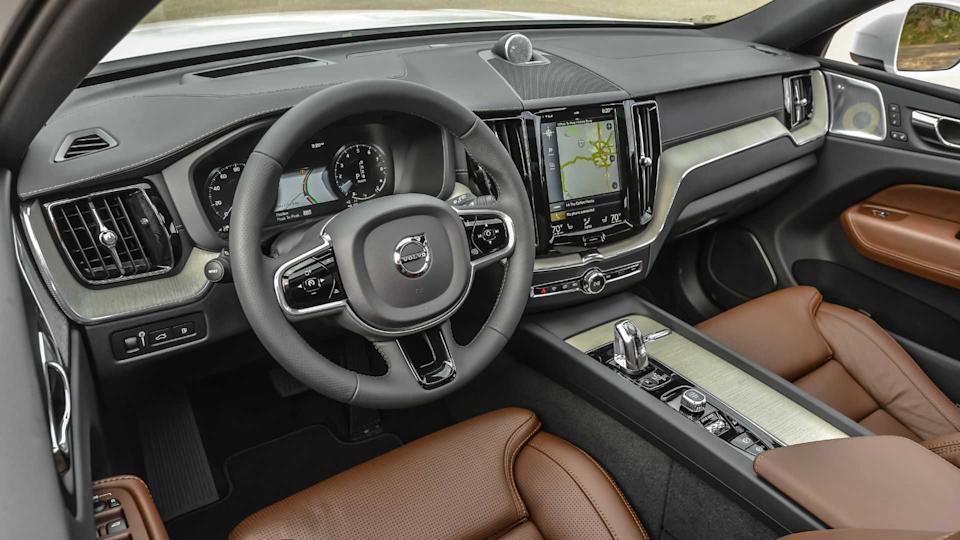 Shot inside the cabin of a 2017 Volvo XC60 T8 Inscription, showing the front seats and dashboard.