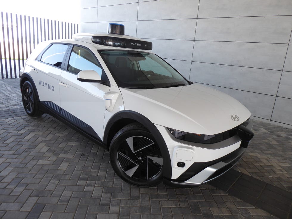 autonomous vehicle equipped with sensors and branding