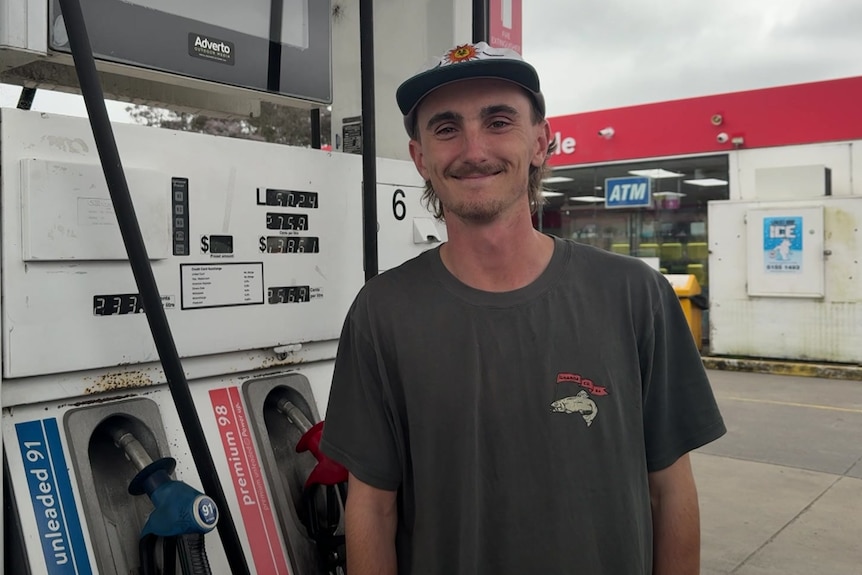 Picture of Gippsland local Will Austin near petrol station pumps smiling