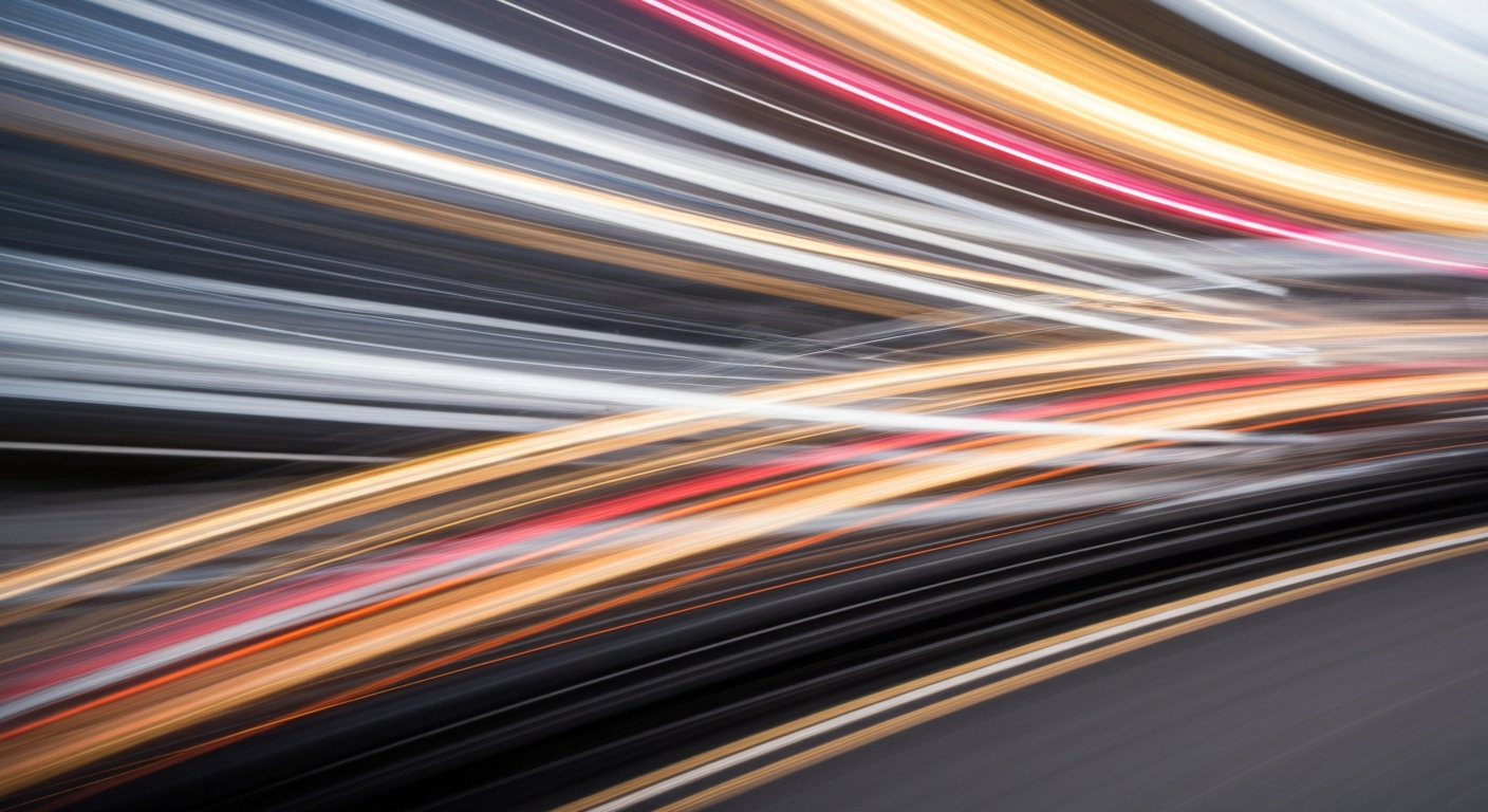 An abstract, colorful image created with a slow shutter speed and panning motion, depicting a vehicle in motion as a series of vibrant, blurred streaks, conveying a sense of speed and energy without any identifiable details.