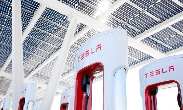 Tesla charging stations under solar panels.