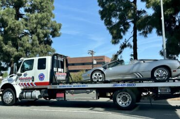 [unknown flatbed] with a Lamborghini Diablo VT Roadster