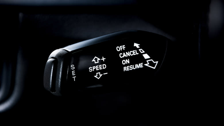 Closeup of the stick controlling cruise control in a car.