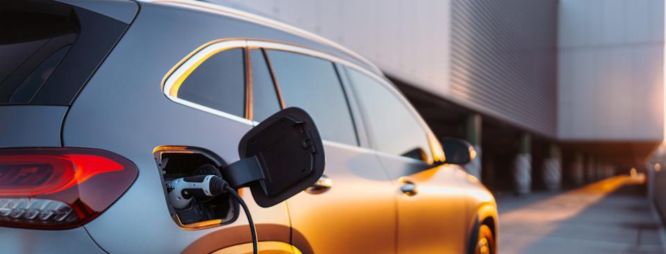 Close-up,Of,Electric,Car,Charging,,Ecology,Transportation,Conept.