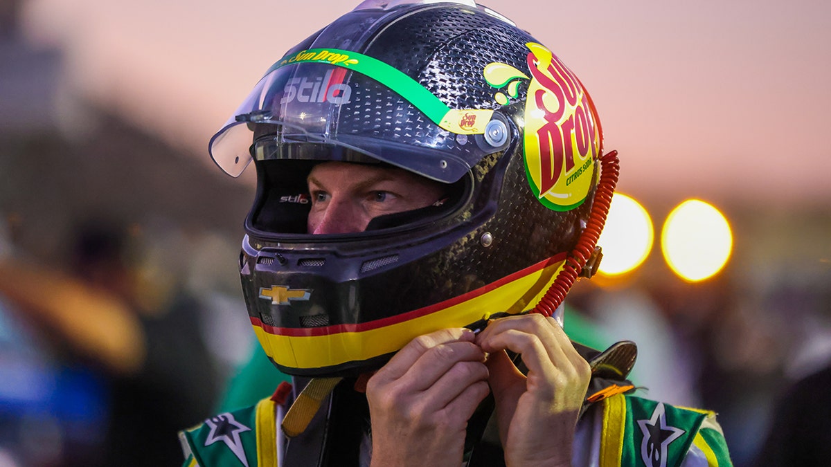 Dale Earnhardt Jr. putting on his helmet at North Wilkesboro Speedway
