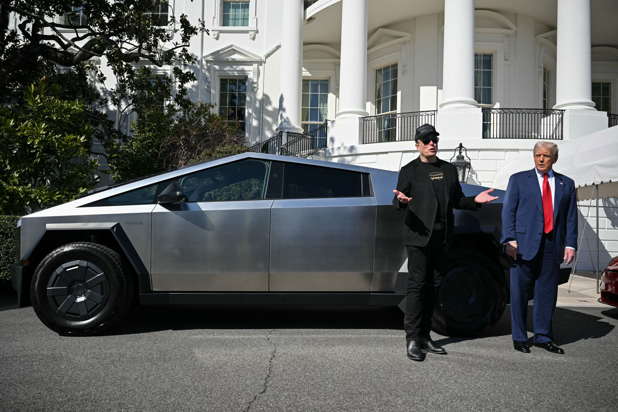 Tesla's Cybertruck, one of which is pictured here with CEO Elon Musk and President Donald Trump, has suffered a long list of setbacks since its 2023 introduction. A new lawsuit lays out a raft of issues one buyer experienced, culminating in a wreck that occurred when the SUV's steering suddenly went out