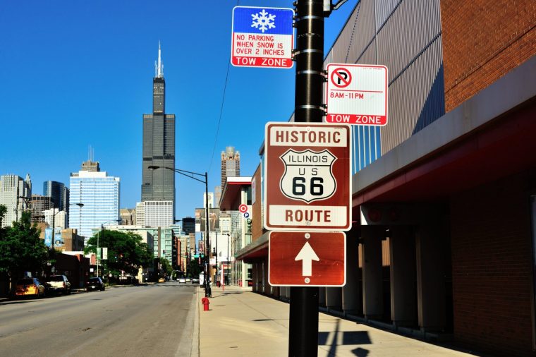 A sign linking Chicago's Jackson Boulevard with the historic US Route 66 appears to be pointing toward the Willis Tower (formerly Sears Tower) which looms in the background. The legendary Route 66 once linked Chicago and Los Angeles with one of its origin points being just a few blocks from the Willis Tower. Also known as the Mother Road, the route ended at its opposite end at the Pacific Ocean by Santa Monica Pier. Many segments of Route 66 are retained and or commemorated throughout its former route. The Willis Tower, once the tallest in the world, remains on of the tallest buildings on the planet and the tallest in Chicago.