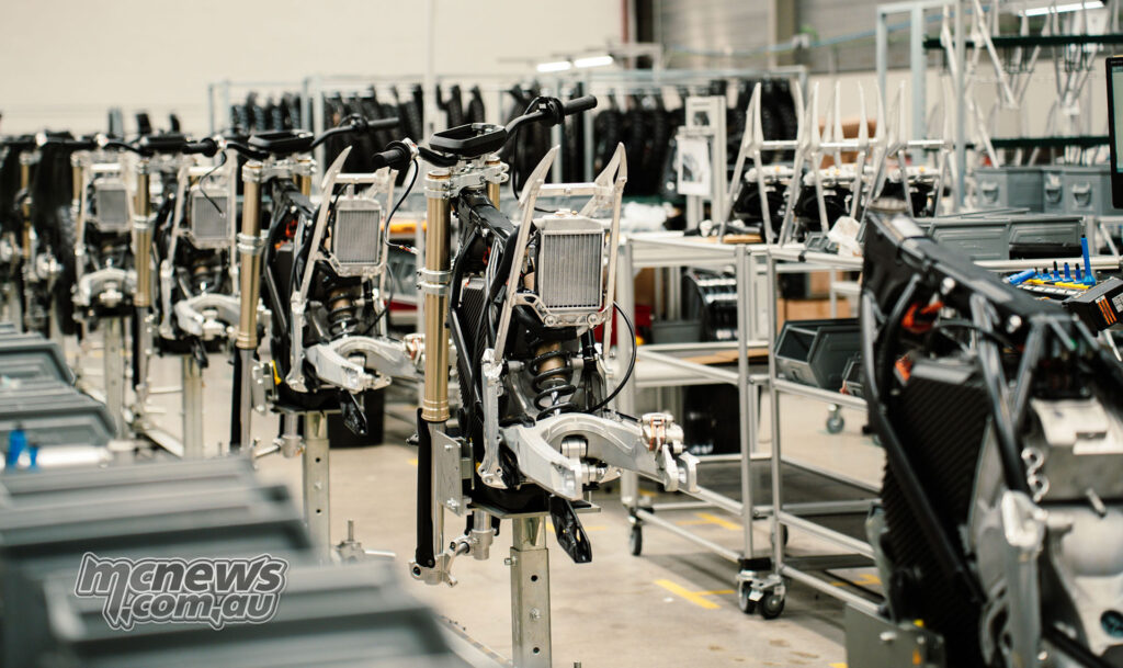 Stark Future motorcycle chassis and assembly stations inside the Barcelona manufacturing facility.