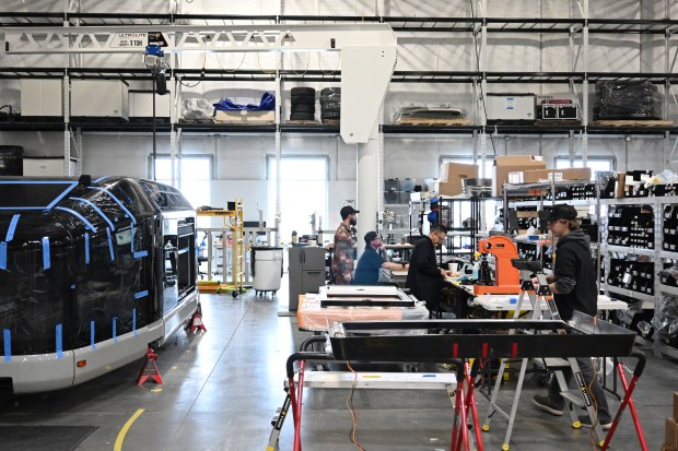 Employees work on building an electric camp trailer made by Lightship RV at the company's manufacturing facility in Broomfield, Colorado, on March 3, 2026. (Photo by RJ Sangosti/The Denver Post)