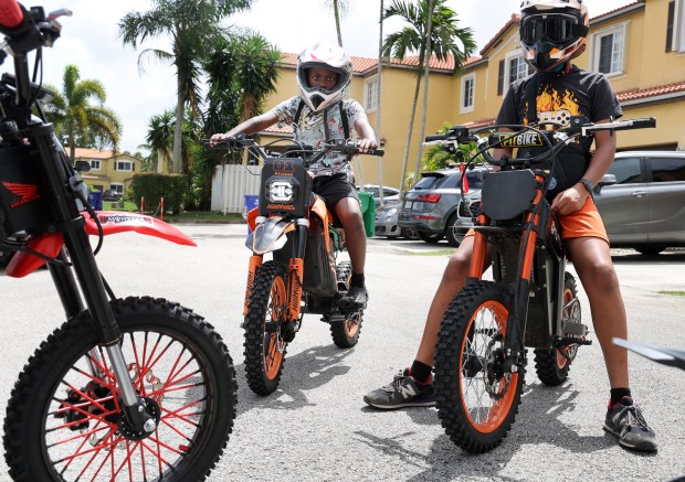 Varren Lacoste, 11, of Miramar, with friends on their e-bikes on Friday, April 3, 2026. (Carline Jean/South Florida Sun Sentinel)