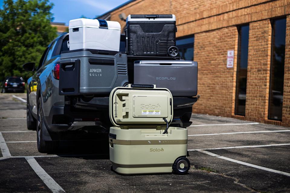 a bunch of coolers on the back of a truck