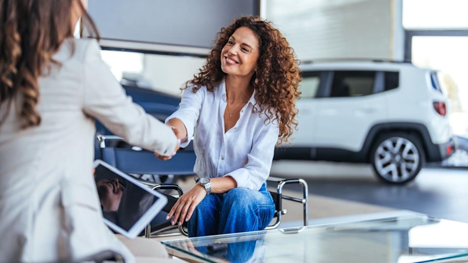 Happy woman buying selling her car