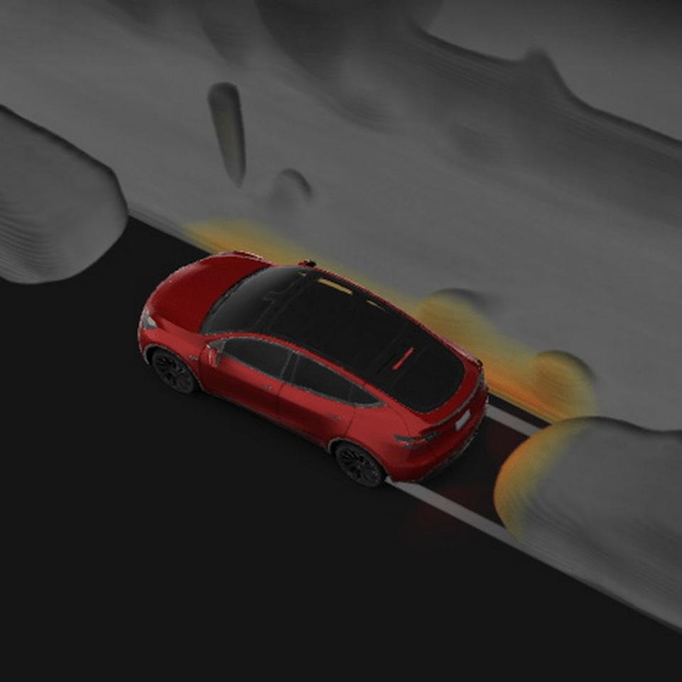 red car navigating a road with visualized airflow patterns