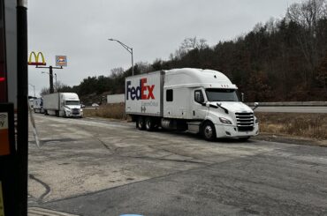 A very large truck with a very small trailer