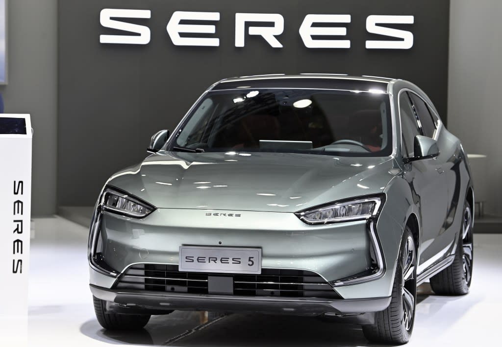 Seres, a China-based automotive manufacturer, is rolling out plans to produce high-end cars with voice-activated toilets. BGA / Shutterstock
