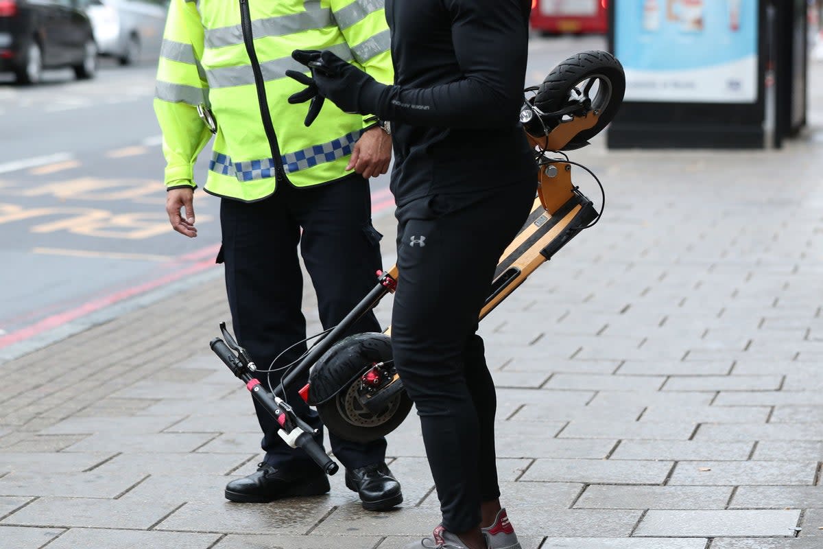 Private e-scooters are banned from being used in public areas across the UK, although they are often ridden illegally in many urban locations (PA)