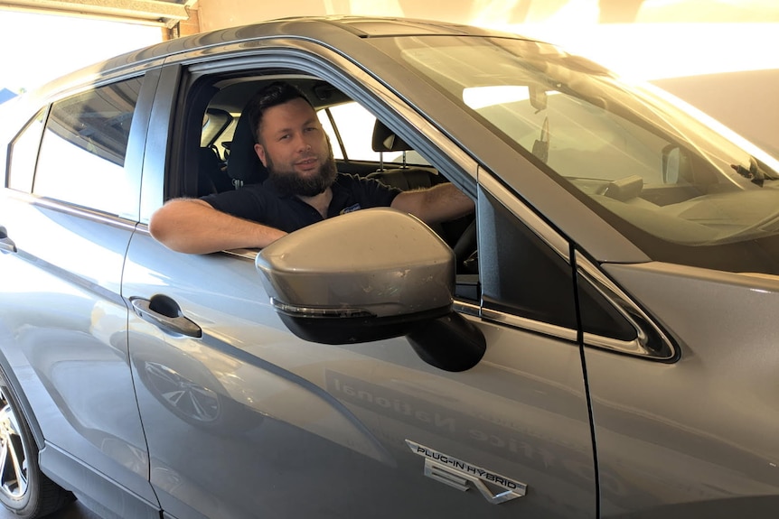 A picture of Ben Grabau inside his plug-in hybrid electric vehicle