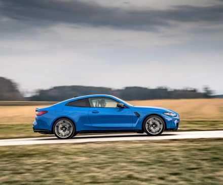 G82 BMW M4 Competition Coupe side driving view