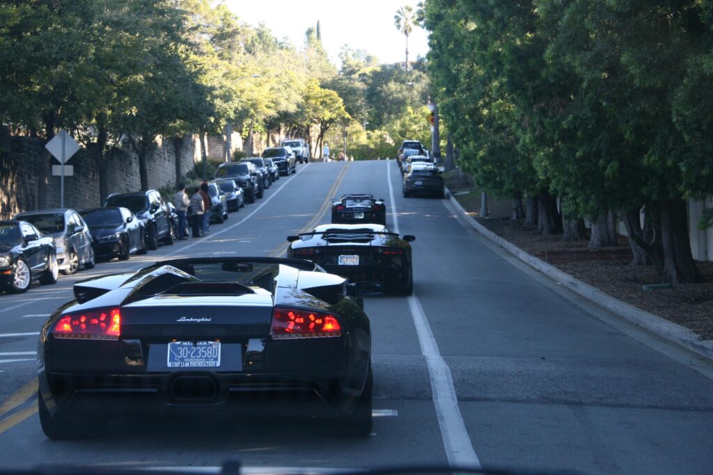 Weird looking [Porsche Boxster] followed by some Fieros