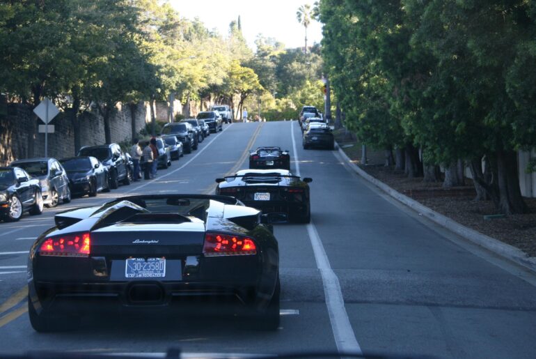 Weird looking [Porsche Boxster] followed by some Fieros