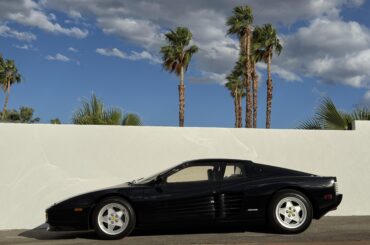 [Ferrari Testarossa] tucked into a back lot