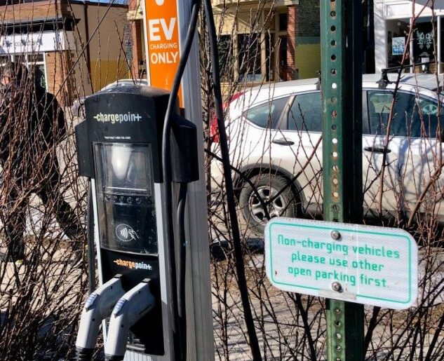 A ChargePoint electric car charging station sits in the parking lot of Jenifer Street Market in Madison, Wis., on Feb. 12, 2022. Jim Malewitz/Wisconsin Watch