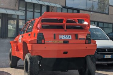 Apparently this is a [Erre 20 Safari ErcOLIs], obviouslt based on a Lancia Delta and on a monegasque plate. Found in Trento, Italy.