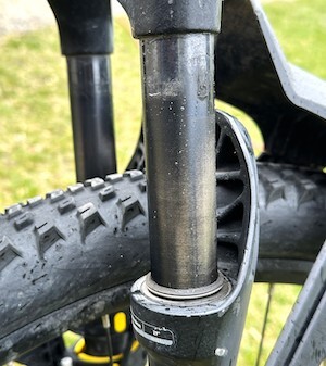 The nubbies on your tires might look brand new (after replacing the old tires) but you can see the wear of many bounces on the front shocks. An e-bike computer will tell the truth about your mileage.