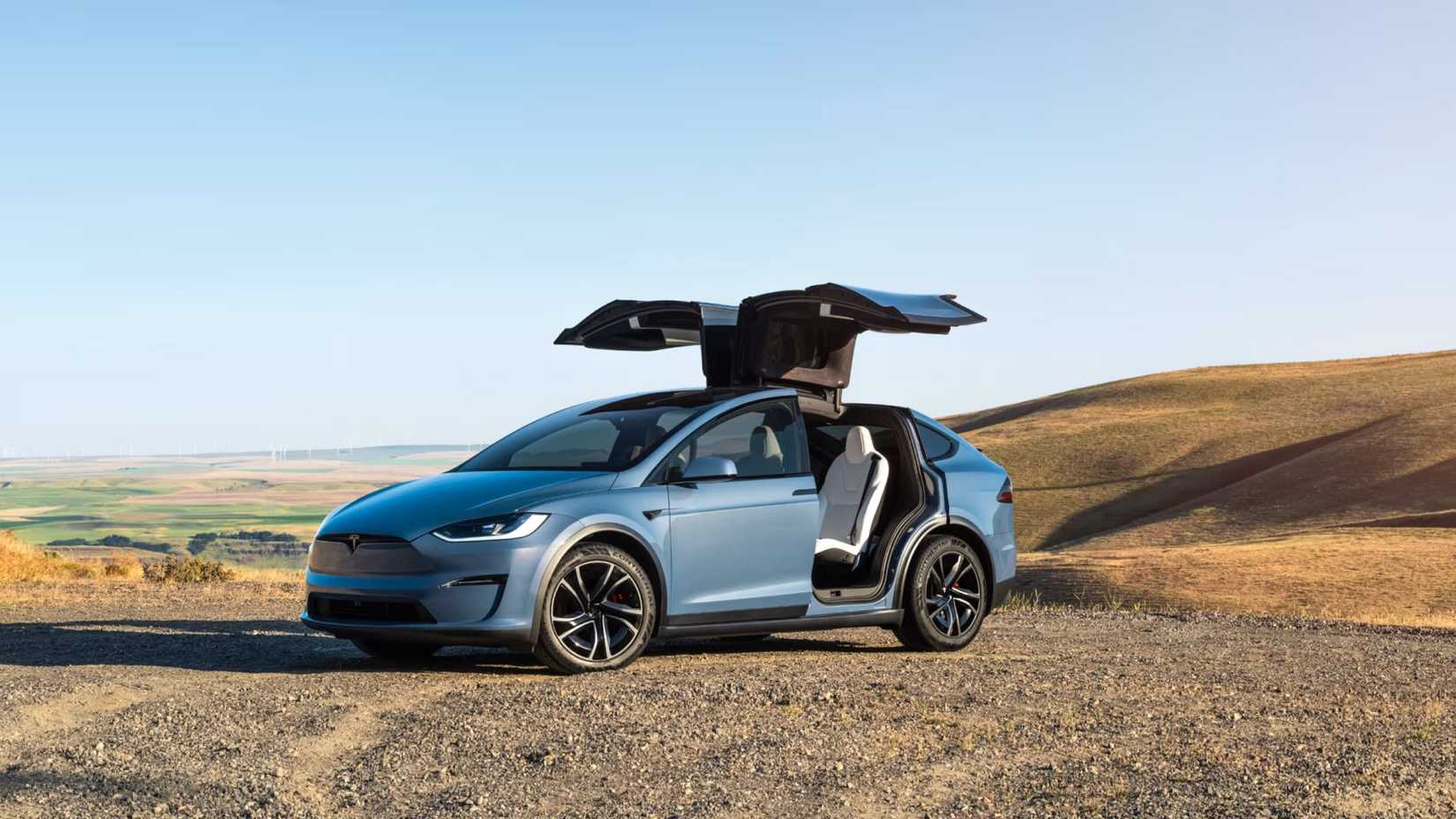 Front 3/4 shot of a 2026 Tesla Model X with door open