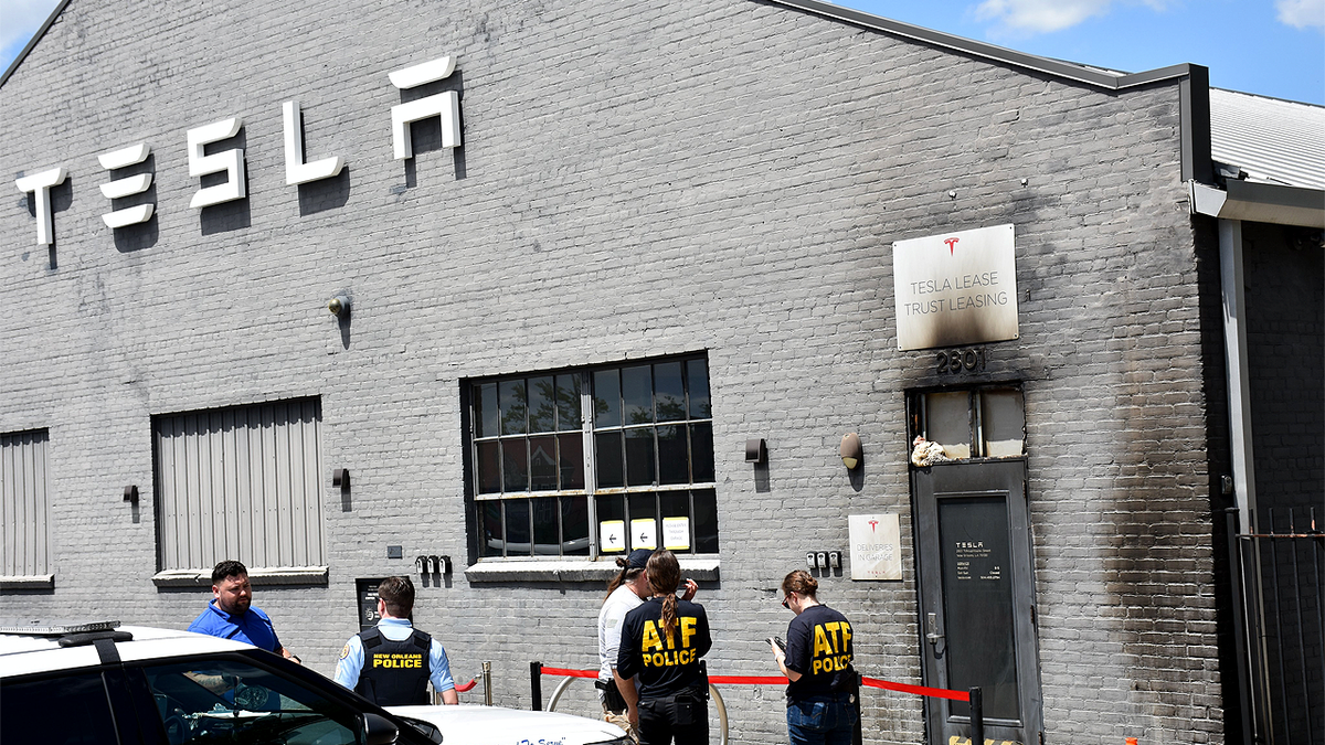 ATF agents and New Orleans police investigate fire damage at Tesla sales office after suspected Molotov cocktail attack