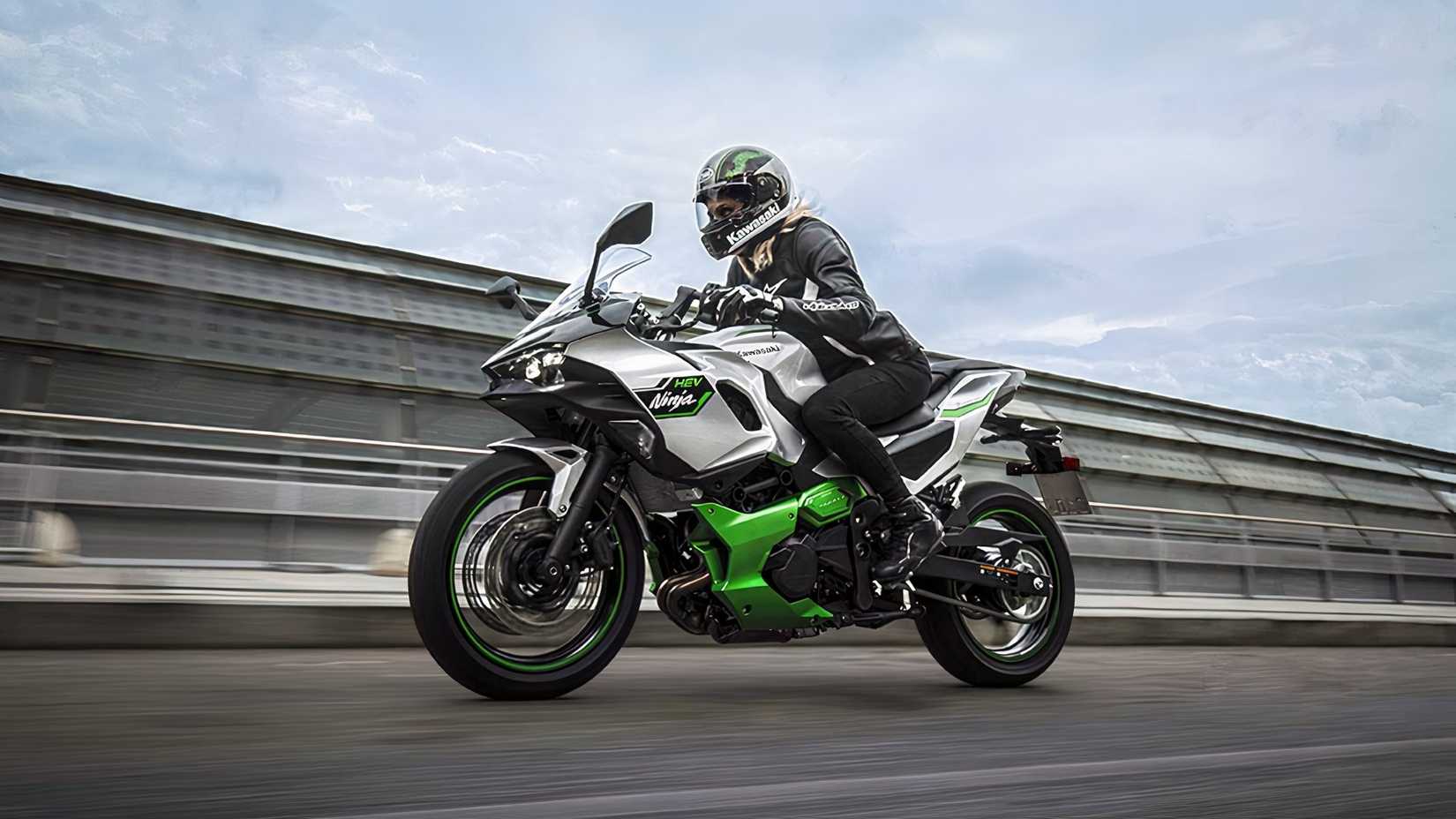 Side shot of a 2024 Kawasaki Ninja 7 Hybrid riding on highway