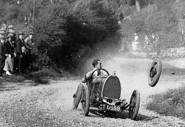 Racing driver, Raymond Mays, from England, loses a wheel from his Type 13 Bugatti at the Caerphilly Hill Climb in Cardiff, Wales. The car remained upright, skidding to a halt just inches from a precipice, 1934.