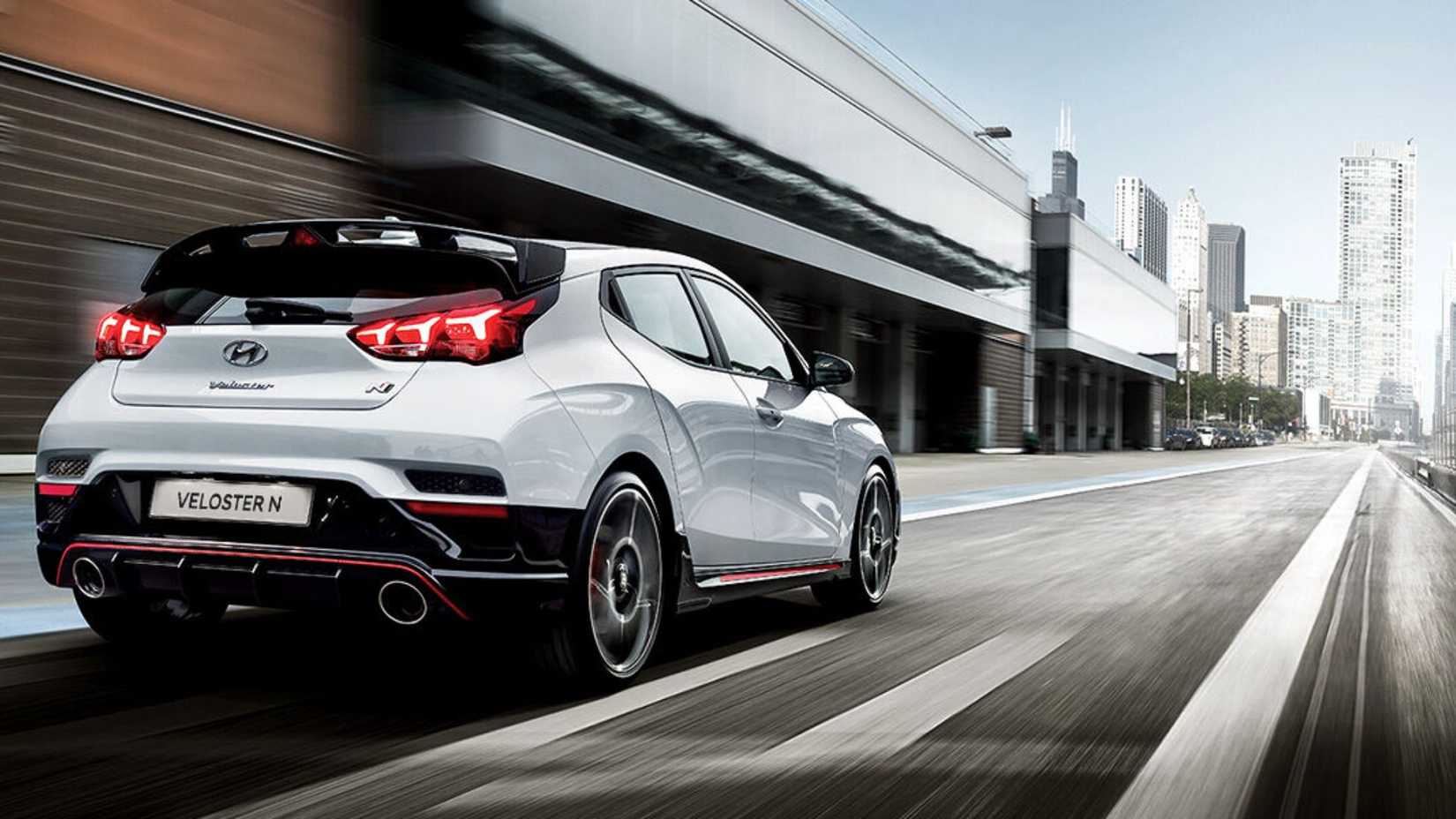 2019-2022 Hyundai Veloster N White Rear Angled View Driving