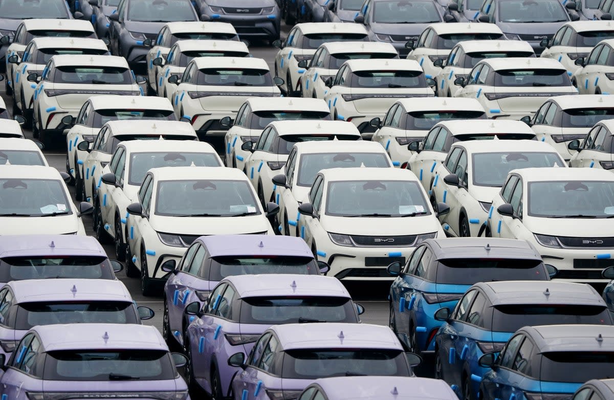 Chinese-made BYD plug-in hybrid electric vehicles in a compound in Sheerness, Kent (PA)