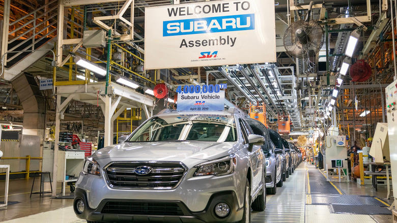 A lines of Subarus are assembled at a factory.
