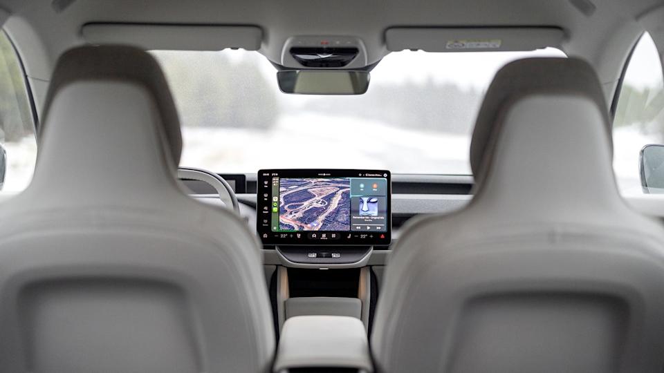 Interior view of a modern car focusing on the dashboard and passenger seats.
