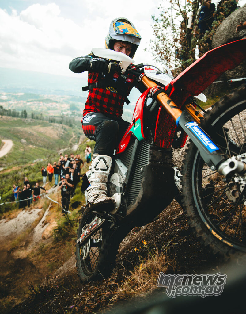 Stark VARG electric enduro bike being ridden up a steep rocky hill climb.