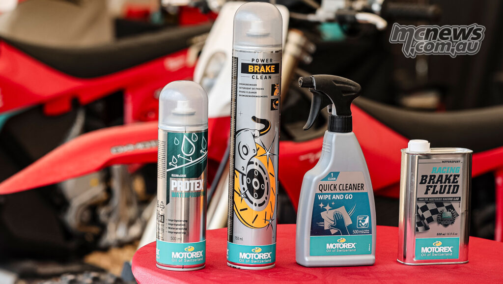 MOTOREX motorcycle maintenance products displayed in front of Stark VARG electric motorcycles.