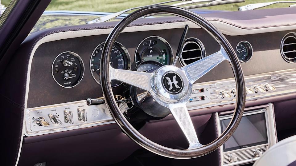 Classic car dashboard with steering wheel and controls