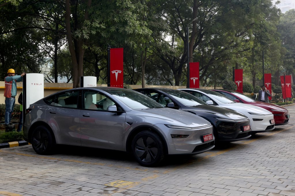 Tesla Model Y cars parked outside the new Tesla center in Gurugram, India.