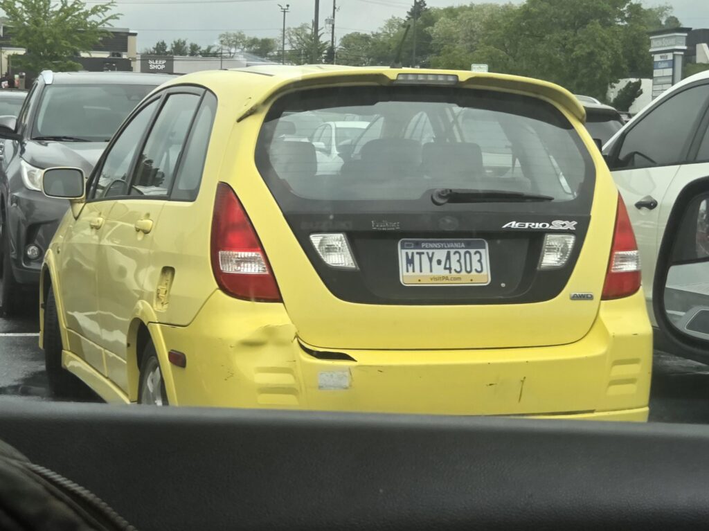 Bright yellow 2004 Suzuki Aerio SX I saw today.