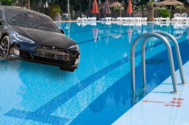 Tesla driving into swimming pool