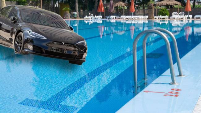 Tesla driving into swimming pool