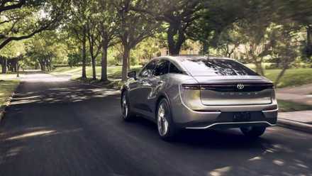 Rear three-quarters shot of the 2023 Toyota Crown driving down the road